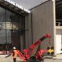 UNIC295 "Spider Crane" preparing to lift glass usi