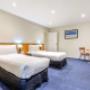 Guest room with three beds
