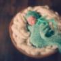 Newborn Katie (in green in basket)