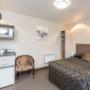 Guest room with microwave and refrigerator