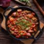 Tomato and Olive Tagine- A vibrant and flavourful Moroccan-inspired dish featuring a rich, slightly tangy sweetness of tomatoes with a savoury punch of olives.