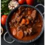 Beef Bourguignon- A slow cooked beef brisket stew braised in red wine with pork lardons, onion, carrots, potato, green beans and mushroom.