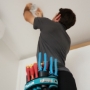 Alexandra Electrician working on lighting