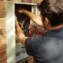 Alexandra Electrician working on switchboard