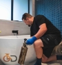 Only Drains clearing a bathroom blockage with kinetic air gun